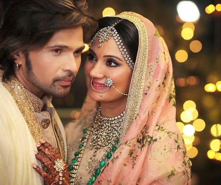 Singer-composer-actor Himesh Reshammiya ties a knot with longtime girlfriend at his residence. This will be his second marriage for Himesh. A simple ceremony held on the night of May 11 at his residence. The ceremony attended by close family and friends. The "Aashiq banaya aapne" and "Tera suroor" hitmaker had last year been granted divorce from Komal, his wife of over two decades, by a court here. He says the decision to separate was amicable. The news of their separation first came to light in September 2016 when they filed for divorce. Last year, Komal had said nobody was responsible for their separation, clarifying her stance on rumours that Sonia may have been a reason behind it. Himesh Reshammiya,Himesh Reshammiya wedding,himesh reshammiya sonia kapoor,Himesh Reshammiya wedding pics,Himesh Reshammiya wedding images,Sonia Kapoor,Sonia Kapoor wedding,Sonia Kapoor wedding pics,Sonia Kapoor wedding images