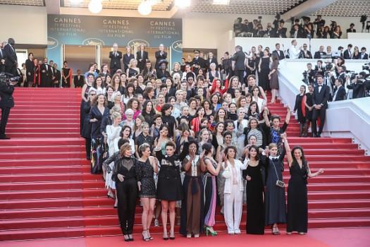 Dozens of women film stars have held a protest at the Cannes film festival against gender-based discrimination in the industry. Cate Blanchett, Kristen Stewart and Jane Fonda were among those taking part in the red-carpet demonstration. The prestigious Cannes festival has come under criticism for failing to showcase more films by women directors. The protest comes after a period of turmoil in the industry following allegations of sexual harassment. This is the first Cannes festival since allegations of sexual abuse were first made against producer Harvey Weinstein last year. He has always denied engaging in non-consensual sex. The actresses and film-makers linked arms to stroll along the red carpet. Cate Blanchett spoke of the film industry's gender inequalities.