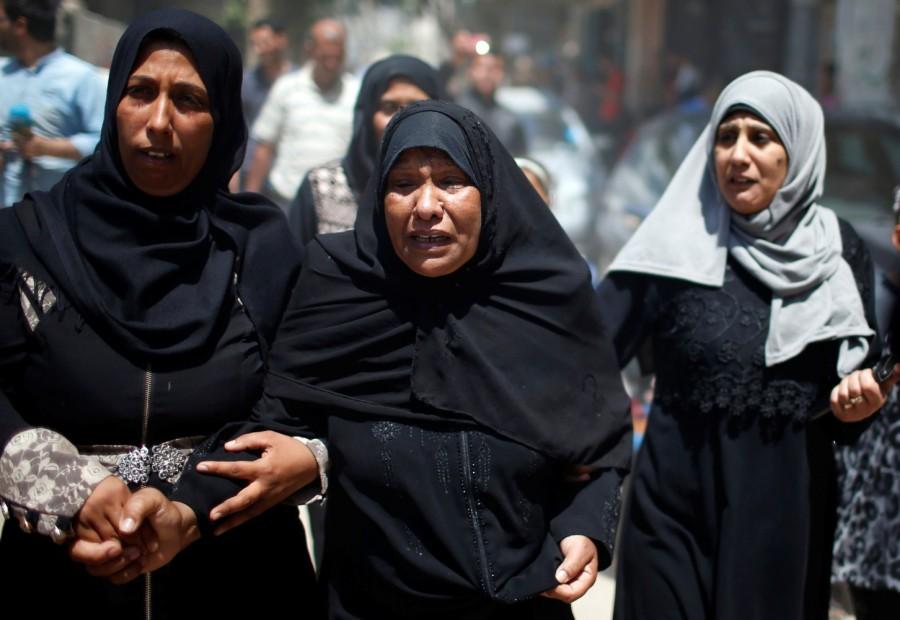 A relative mourns during the funeral of 8-month-old Palestinian infant Laila al-Ghandour, who died after inhaling tear gas during a protest against U.S embassy move to Jerusalem at the Israel-Gaza border, in Gaza City May 15, 2018. Palestinian baby,border protest,Palestinian border protest,Israel-Gaza border,Laila al-Ghandour