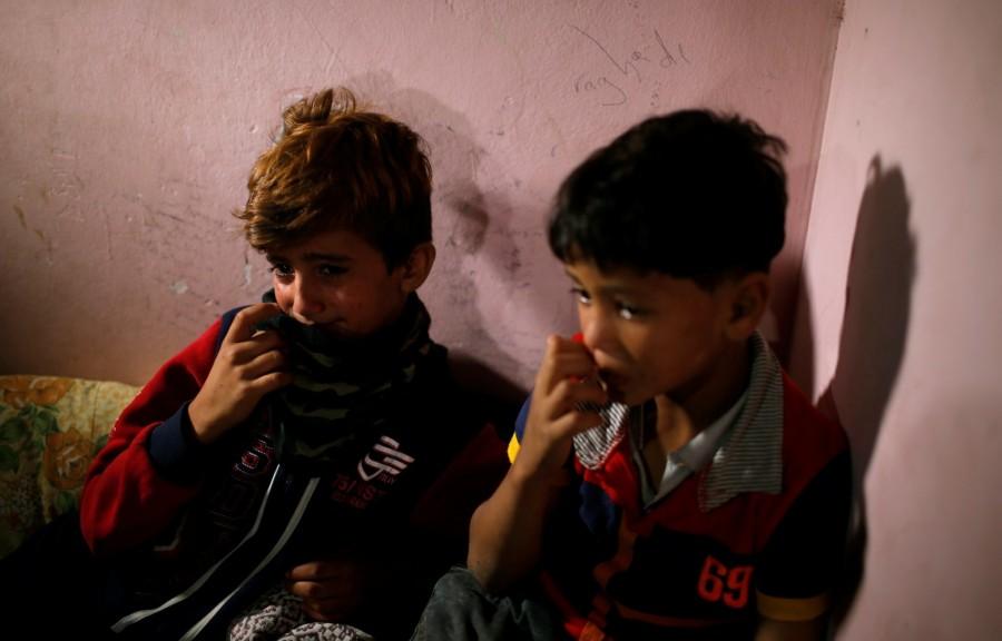 Relatives cry during the funeral of eight-month-old Palestinian infant Laila al-Ghandour, who died after inhaling tear gas during a protest against U.S embassy move to Jerusalem at the Israel-Gaza border, in Gaza City May 15, 2018. Palestinian baby,border protest,Palestinian border protest,Israel-Gaza border,Laila al-Ghandour