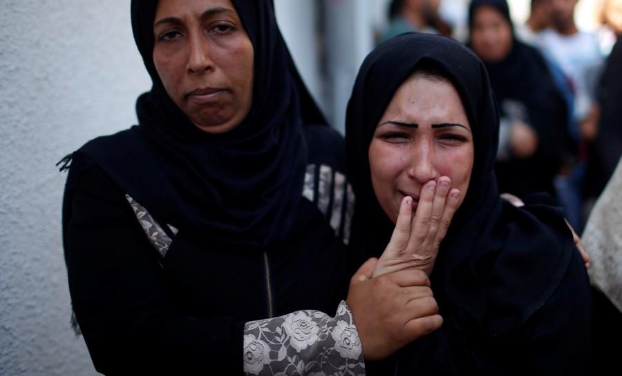 The mother of 8-month-old Palestinian infant Laila al-Ghandour, who died after inhaling tear gas during a protest against U.S. embassy move to Jerusalem at the Israel-Gaza border, mourns during her funeral in Gaza City May 15, 2018. Palestinian baby,border protest,Palestinian border protest,Israel-Gaza border,Laila al-Ghandour