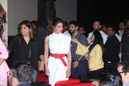 Jacqueline Fernandez looked stunning in a white and red dress she wore yesterday. She started with a white Lavish Alice dress and Yeezy clear sandals and for the party, she changed into a polka-dotted dress. Jacqueline looks ethereal in white as she walked in for the trailer launch of her next Race 3. Jacqueline Fernandez who dressed in a white scuba frill dress with Structural frills looks bewildering. She added a dash of color with a bright red waist belt, accentuating her hourglass figure. She wore a broad red belt along pellucid clear heels with the white dress.