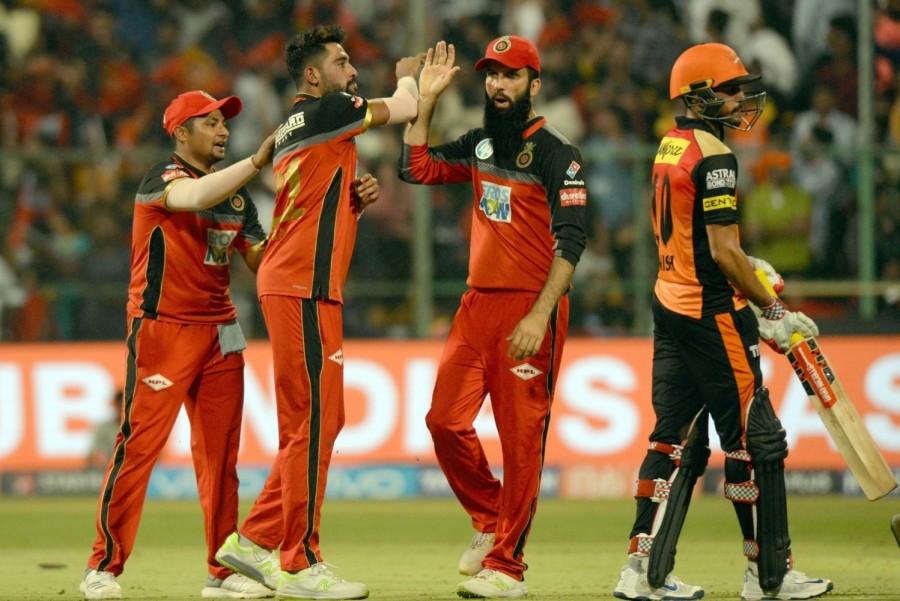 Earlier, de Villiers and Moeen Ali smacked breezy half centuries to help Bangalore overcome a shaky start and post a mammoth 218/6 against Hyderabad in a must-win tie. De Villiers (69 from 39 balls; 4x12, 6x1) and Moeen (65 from 34; 4x2, 6x6) put on a 107-run third wicket stand to resurrect RCB's innings which fell apart after the early loss of the opening duo of Parthiv Patel (1) and skipper Virat Kohli (12). Put in to bat, Parthiv failed to take advantage of the dropped chance off the very first ball and departed off the final ball off Sandeep Sharma, caught by Siddharth Kaul at third man. Kohli followed his opening partner soon after adding 32 runs with de Villiers, as the India skipper's struggle with the spinners continued in this edition of the IPL. The right-hander attempted to slog Rashid Khan's fuller length delivery hoping for a googly only to find his stumps re-arranged. Royal Challengers Bangalore,Sunrisers Hyderabad,RCB beats SRH,Kane Williamson,Manish Pandey,Virat Kohli,Indian Premier League,Indian Premier League 2018,Ipl 2018
