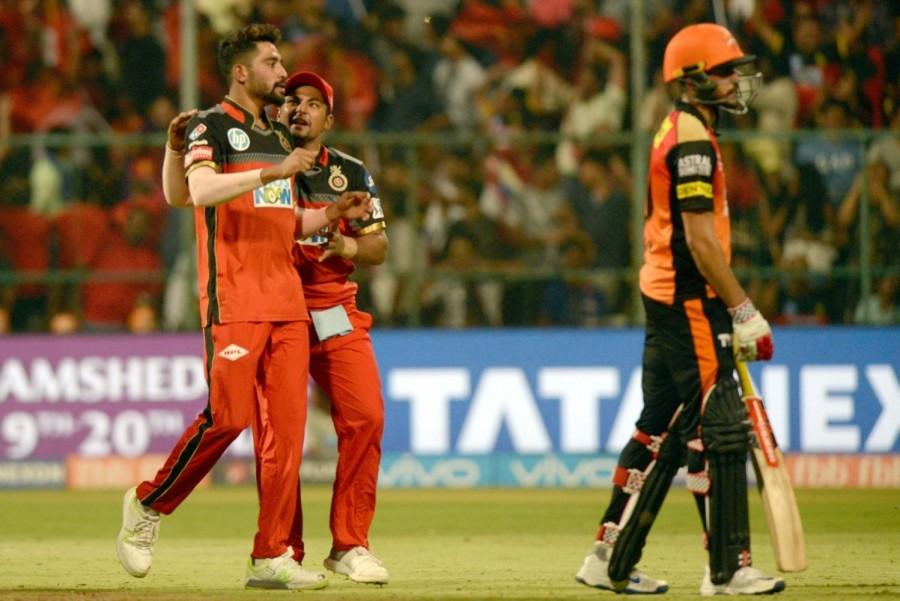 Struggling at 32/2, de Villiers and Moeen changed the complexion of the innings in no time, with both batsmen trying to outscore each other as it started raining boundaries at the Chinnaswamy Stadium. De Villiers started with two consecutive boundaries off Shakib Al Hasan before sending the other Hyderabad bowlers to the leather hunt, before Moeen joined the party by welcoming rookie pacer Basil Thampi with two consecutive sixes. In no time, the South African veteran brought up his half century in mere 32 balls, when he pulled medium pacer Kaul for a boundary before Moeen, who was dropped on 23 by Dhawan off Sandeep, turned on the heat by meting out some special treatment to Thampi. The English southpaw mercilessly smacked Thampi for a boundary to bring up his maiden IPL half century off just 25 balls before Afghan leg-spinner Rashid came back to break the partnership in a span of three balls. Royal Challengers Bangalore,Sunrisers Hyderabad,RCB beats SRH,Kane Williamson,Manish Pandey,Virat Kohli,Indian Premier League,Indian Premier League 2018,Ipl 2018