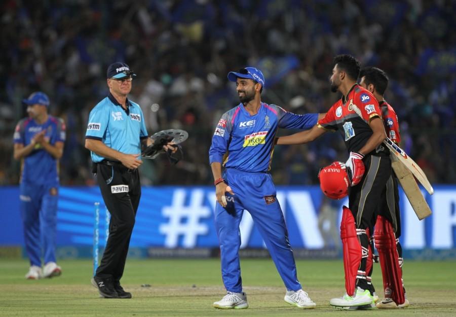 Rajasthan Royals rode on a fine half century from Rahul Tripathi, combined with leg-spinner Shreyas Gopal's four-for to outclass Royal Challengers Bangalore (RCB) by 30 runs and more importantly keep themselves in the hunt for a place in the Indian Premier League (IPL) Play-offs. With the win, Rajasthan rose to the fourth spot in the IPL tally with 14 points while RCB's campaign has ended on a disappointing note, thanks to their inconsistent performances in this edition. On Saturday, the visitors made a heavy weather of their chase of Rajasthan's 164/5 to be eventually bundled out for 134 runs, with Gopal (4/16) ripping through the top order at the Sawai Mansingh Stadium here. Gopal was complimented well by fellow spinners Krishnappa Gowtham (1/6) and Ish Sodhi (1/31) while the pace twins of Jaydev Unadkat and Ben Laughlin shared the rest of the four scalps between them. Barring AB de Villiers (53 from 35 balls; 4x7) and Parthiv Patel (33 from 21; 4x3, 6x2), none of the visiting batsmen could offer any resistance to the disciplined Rajasthan bowling as wickets kept tumbling at regular intervals. While Gowtham started the onslaught with the wicket of skipper Virat Kohli (4) in the third over, Gopal accounted for the scalps of Parthiv, de Villiers, Moeen Ali (1) and Mandeep Singh (3) in quick succession. Rajastan beat Bangalore,Rajasthan Royals,Royal Challengers Bangalore,Indian Premier League,Indian Premier League 2018,IPL 2018,IPL 2018 pics,Virat Kohli