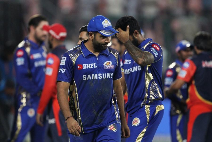 Delhi Daredevils (DD) rode a strong bowling display to notch up an 11-run victory and eliminate Mumbai Indians from the race for the Indian Premier League (IPL) play-offs at the Ferozshah Kotla here on Sunday. Chasing a target of 175 runs in what was a must-win encounter for them, Mumbai were bundled out for 163 runs in 19.3 overs. Mumbai thus completed the league phase with 12 points from their 14 matches. With Rajasthan Royals already on 14 points and Sunrisers Hyderabad, Chennai Super Kings and Kolkata Knight Riders already qualified, defending champions Mumbai saw their title defence come to an end. But it was by no means an easy victory. Despite losing wickets at regular intervals, Mumbai kept up a healthy scoring rate and kept the packed stadium on the edge of their seats till the very end. Leggie Amit Mishra was the most successful among the Delhi bowlers with figures of 3/19 in his four overs. Sandeep Lamichhane claimed 3/36 while Harshal Patel returned with figures of 3/28. Mumbai suffered their first jolt in the opening over when Suryakumar Yadav (12) holed out to long-on off the bowling of Sandeep Lamichhane. Delhi Daredevils,Delhi Daredevils beats Mumbai Indians,Mumbai Indians,IPL 2018,Indian Premier League,Indian Premier League 2018,Rohit Sharma