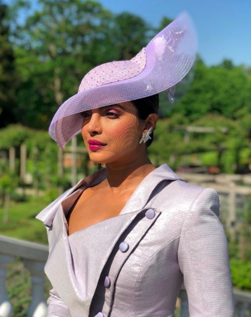 Internationally acclaimed Indian actress Priyanka Chopra, who made heads turn with her chic lilac dress suit at actress Meghan Markle and Prince Harry's wedding on Saturday, says the day will be remembered as it stood for change and hope. Taking to Instagram with an image of the newly married royal couple, who can be seen coming out of the chapel after exchanging their vows, Priyanka wrote an emotional note conveying her love and belief in the marriage. She wrote: "Every once in a while there is a moment when time stands still... That happened today... You my friend were the epitome of grace, love and beauty. Every choice made at this wedding by you both will go down in history, not just because it was your wedding but because this incredible wedding stood for change and hope. Both things that the world needs desperately. "Thank you for being the perfect picture of all things good... Seeing your union and love blessed in front of my eyes made me so happy and tear up! I wish you both love happiness and togetherness always," she added. Priyanka Chopra,actress Priyanka Chopra,Meghan Markle and Prince Harry wedding,Meghan Markle wedding,Prince Harry wedding,Meghan Markle and Prince Harry marriage