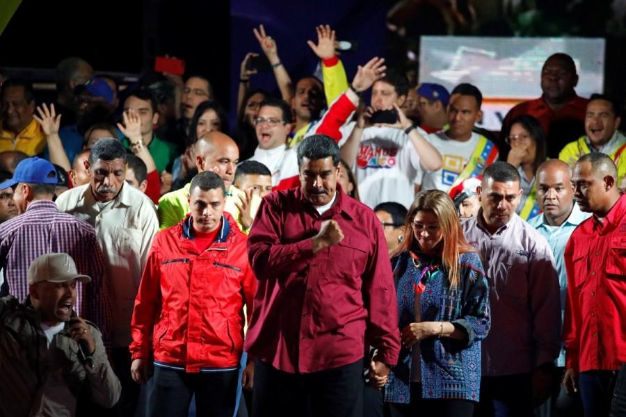 Venezuela's President Nicolas Maduro has won the election, claiming a second six-year term, in a vote marred by an opposition boycott and alleged foul play, media reported on Monday. With more than 90 per cent of the votes counted on Sunday, 55-year-old Maduro had 67.7 per cent, 5.8 million votes, the BBC reported quoting National Electoral Council chief Tibisay Lucena as saying. The main opposition candidate, Henri Falcon won 21.2 per cent, 1.8 million votes, she said. Falcon rejected the result soon after the polls closed, saying, "We do not recognise this electoral process as valid. We have to have new elections in Venezuela." The early reports said turnout for the controversial vote was unusually low, about 46 per cent of the electorate. Falcon had earlier alleged that the vote had been rigged in Maduro's favour, by abuse of the scanning of state-issued benefits card, used for accessing food. Government officials said the polls were "free and fair" but most of the opposition had joined a boycott. The elections were supposed to be held in December 2018, but the National Constituent Assembly, made up exclusively of Maduro's supporters, brought them forward. Nicolas Maduro,President Nicolas Maduro,Nicolas Maduro re-elected