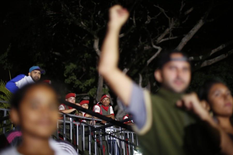 Soldiers look on as supporters of Venezuela's President Nicolas Maduro celebrate the results of the election, outside of Miraflores Palace in Caracas, Venezuela, May 20, 2018. Nicolas Maduro,President Nicolas Maduro,Nicolas Maduro re-elected