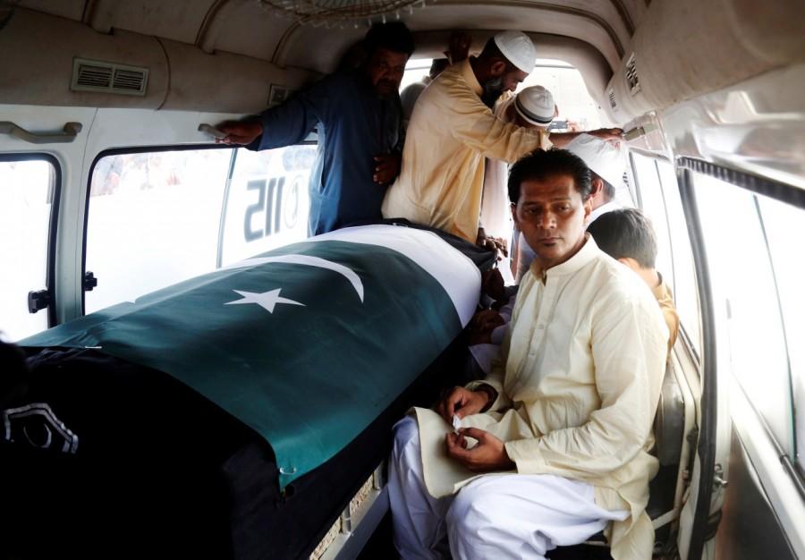 A Pakistani exchange student killed in a mass shooting in Texas was buried in her home town of Karachi, her coffin draped with Pakistan's green and white flag. Aziz Sheikh father of Sabika Aziz Sheikh, a Pakistani exchange student, who was killed with others when a gunman attacked Santa Fe High School in Santa Fe, Texas, U.S., sits in an ambulance next to her coffin, wrapped in national flag, during a funeral in Karachi, Pakistan May 23, 2018. Funeral for Pakistani student,Pakistani student,Texas school shooting,Texas shooting,texas shooting incident,Texas shooting 26 killed,South Texas shooting