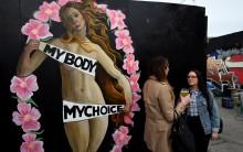 An upcoming vote on whether to scrap the 1983 ban on abortion is the latest referendum to gauge just how much has changed in Ireland, once one of Europe's most socially conservative and staunchly Catholic countries. Women chat in front of a Pro-Choice mural ahead of a 25th May referendum on abortion law, in Dublin, Ireland.