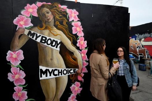 An upcoming vote on whether to scrap the 1983 ban on abortion is the latest referendum to gauge just how much has changed in Ireland, once one of Europe's most socially conservative and staunchly Catholic countries. Women chat in front of a Pro-Choice mural ahead of a 25th May referendum on abortion law, in Dublin, Ireland.