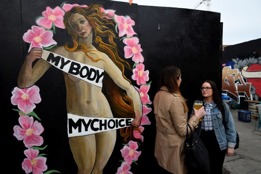 An upcoming vote on whether to scrap the 1983 ban on abortion is the latest referendum to gauge just how much has changed in Ireland, once one of Europe's most socially conservative and staunchly Catholic countries. Women chat in front of a Pro-Choice mural ahead of a 25th May referendum on abortion law, in Dublin, Ireland. Abortion referendum,Pro-Choice mural,abortion law,Ireland