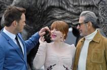 Cast members (L to R) Chris Pratt, Bryce Dallas Howard, and Jeff Goldblum pose in front of a model dinosaur during a photocall to promote the forthcoming film 'Jurassic World: Fallen Kingdom' in London, Britain, May 24, 2018. Universal Pictures India's "Jurassic World: Fallen Kingdom", which was scheduled to release on June 8 in India, will now open a day before. The film is all set to now release in India on June 7. The second instalment of the "Jurassic World" series will open on Thursday in more than 2300 screens, two weeks before its US release date. "Jurassic World: Fallen Kingdom" will release in English, Hindi, Tamil and Telugu. In the film, directed by J.A. Bayona, stars Chris Pratt and Bryce Dallas Howard will reprise their roles from "Jurassic World" as Owen and Claire, respectively. Actor Jeff Goldblum will returns as Dr. Ian Malcolm.