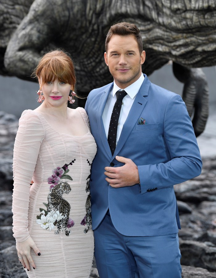 Cast members Chris Pratt and Bryce Dallas Howard pose in front of a model dinosaur during a photocall to promote the forthcoming film 'Jurassic World: Fallen Kingdom' in London, Britain, May 24, 2018. Chris Pratt,Bryce Dallas Howard,Jeff Goldblum,Jurassic World: Fallen Kingdom Photocall,Jurassic World,Fallen Kingdom Photocall