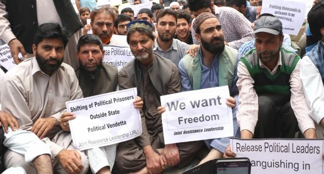 Jammu and Kashmir Liberation Front (JKLF) chairman and senior leader of Joint Resistance Leadership (JRL), Muhammad Yasin Malik on Saturday sat on protest in summer capital Srinagar. Leading dozens of JRL supporters, Malik staged a protest sit-in in Press Enclave in Srinagar city. Addressing his supporters, Malik said the government must release all prisoners including Asiya Andrabi, her husband, Qasim Faktoo, Masarat Alam and others. He also demanded shifting back of Kashmiri prisoners from jails outside the state. 