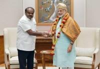 "Chief Minister of Karnataka Kumaraswamy called on Prime Minister," the Prime Minister's Office (PMO) said in tweet attaching pictures of the two leaders meeting. Five days after being sworn in as Karnataka Chief Minister, H.D. Kumaraswamy on Monday called on Prime Minister Narendra Modi. This was Kumaraswamy's first meeting with Modi since taking over power in the state after his Janata Dal-Secular formed the government in alliance with the Congress. Kumaraswamy is in Delhi to meet Modi and other Union Ministers to seek financial assistance for farm loan waiver -- a "priority" for his government.