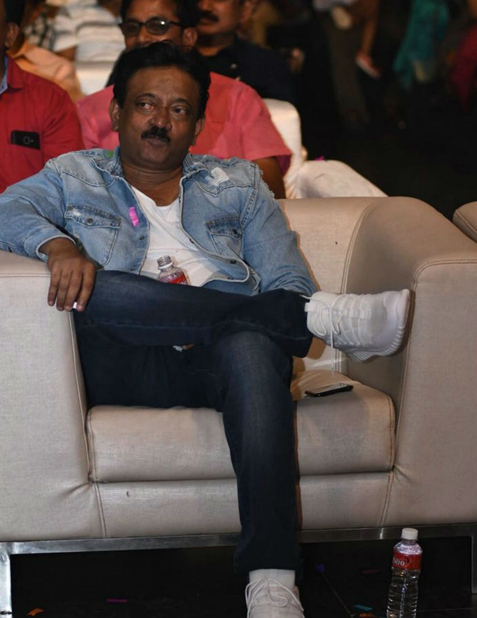 Ram Gopal Varma poses for the cameras during Officer pre-release event. Akkineni Nagarjuna,Myra Sareen,Amala Akkineni,Naga Chaitanya,Akhil Akkineni,MM Keeravani,Ram Gopal Varma,Officer,Officer pre-release event,Officer pre-release event pics,Officer pre-release event images
