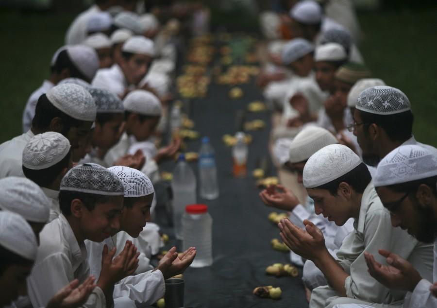 Muslims offer prayers before having their Iftar (fast-breaking) meal during the holy month of Ramadan at a madrasa or religious school on the outskirts of Jammu Ramadan 2018,Ramadan,happy Ramadan,Ramadan fasting,breaking their fast,people breaking their fast,Ramadan 2018 pics,Ramadan 2018 images,Ramadan 2018 stills,Ramadan 2018 pictures,iftar,ramadan iftar