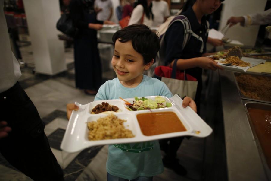 A Muslim boy residing in Japan has his iftar, breaking of fast meal, during the holy month of Ramadan at Tokyo Camii mosque in Tokyo Ramadan 2018,Ramadan,happy Ramadan,Ramadan fasting,breaking their fast,people breaking their fast,Ramadan 2018 pics,Ramadan 2018 images,Ramadan 2018 stills,Ramadan 2018 pictures,iftar,ramadan iftar