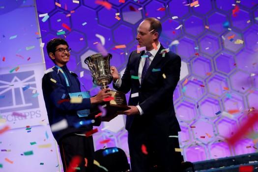 Karthik Nemmani celebrates with E.W. Scripps Company CEO Adam Symson after winning the Scripps National Spelling Bee at National Harbor in Oxon Hill, Maryland, U.S., May 31, 2018.