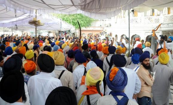 Sikhs stage a demonstration against Operation Blue Star during a programme organised to pay tributes to those killed in the military operation at Golden Temple in Amritsar on June 6, 2018. Brandishing of swords and open use of sticks was witnessed on Wednesday during a ceremony to mark the 34th anniversary of the Army's 'Operation Blue Star' inside the Golden Temple complex. The clash between radical Sikh elements and the Shiromani Gurdwara Parbandhak Committee (SGPC) took place right in front of the Akal Takht, the highest temporal seat of Sikh religion.
