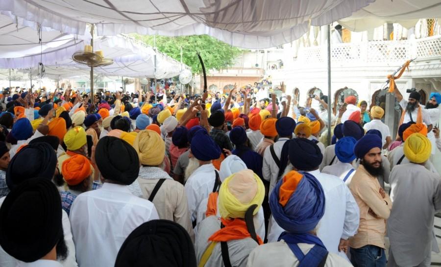 Sikhs stage a demonstration against Operation Blue Star during a programme organised to pay tributes to those killed in the military operation at Golden Temple in Amritsar on June 6, 2018. Brandishing of swords and open use of sticks was witnessed on Wednesday during a ceremony to mark the 34th anniversary of the Army's 'Operation Blue Star' inside the Golden Temple complex. The clash between radical Sikh elements and the Shiromani Gurdwara Parbandhak Committee (SGPC) took place right in front of the Akal Takht, the highest temporal seat of Sikh religion. Operation Blue Star,Golden Temple,Amritsar,golden temple amritsar,Sikhs
