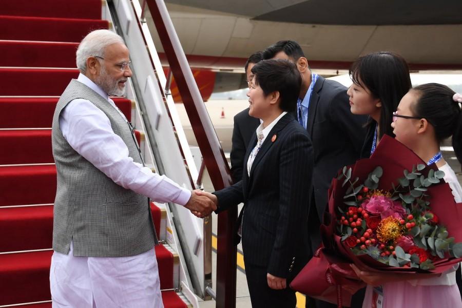 After his arrival on Saturday afternoon in Qingdao, Modi is scheduled to hold the bilateral meeting with Xi. It comes over a month after their informal summit on April 27-28 in Wuhan on a Chinese invitation, when they pledged to keep the India-China border quiet and personally guide their respective armies to avert a Doklam-like military stand-off in future. PM Narendra Modi,Narendra Modi,Narendra Modi in China,Modi in China,SCO Summit,Modi at SCO Summit,SCO Summit pics,SCO Summit images