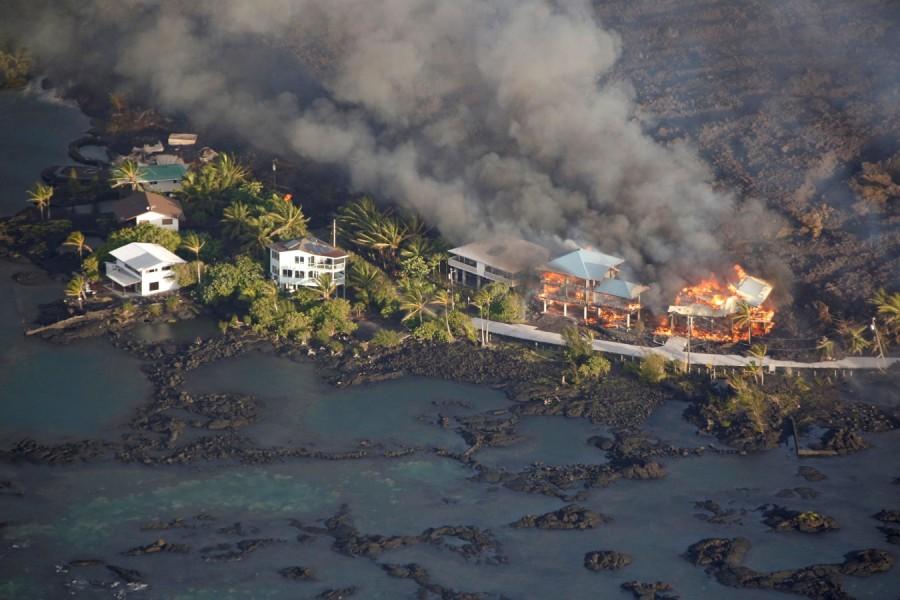 Lava destroys homes in the Kapoho area, east of Pahoa, during ongoing eruptions of the Kilauea Volcano in Hawaii, U.S., June 5, 2018. Kilauea Volcano,Kilauea volcano eruption,Kilauea volcano lava,Kilauea volcano lava flow,Hawaii's Kilauea volcano