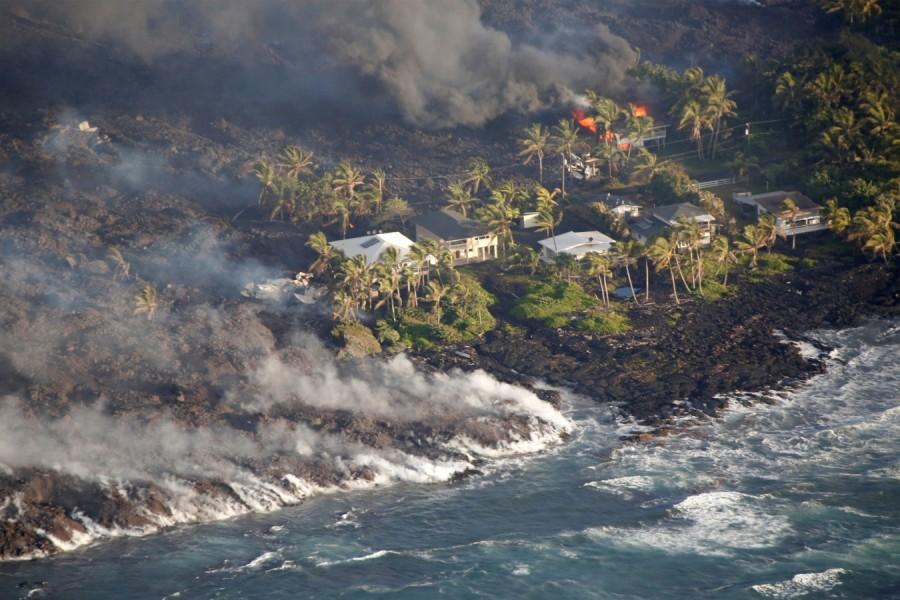 Lava destroys homes in the Kapoho area, east of Pahoa, during ongoing eruptions of the Kilauea Volcano in Hawaii, U.S., June 5, 2018. Kilauea Volcano,Kilauea volcano eruption,Kilauea volcano lava,Kilauea volcano lava flow,Hawaii's Kilauea volcano