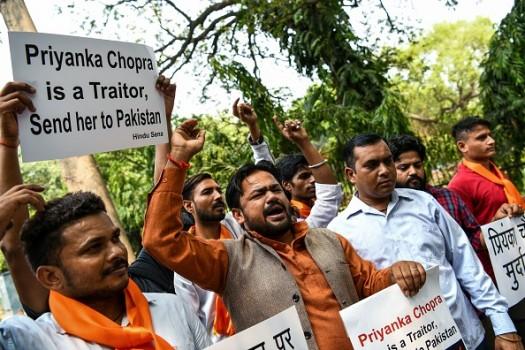 Members of an Indian Hindu outfit Hindu Sena shout slogans as they protest against the Bollywood superstar Priyanka Chopra, who appeared in an American TV series episode that showed Indian nationalists trying to frame Pakistan in a terrorist plot, in New Delhi on June 9, 2018. - Social media users have been trolling Chopra, saying she had betrayed the country and her fans through her act, since the episode was aired on June 1.