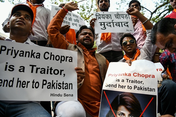Members of an Indian Hindu outfit Hindu Sena burn posters bearing the image of Bollywood superstar Priyanka Chopra, who appeared in an American TV series episode that showed Indian nationalists trying to frame Pakistan in a terrorist plot, in New Delhi. Priyanka Chopra,actress Priyanka Chopra,Priyanka Chopra Quantico,Quantico,Priyanka Chopra Quantico row,Priyanka Chopra posters torched