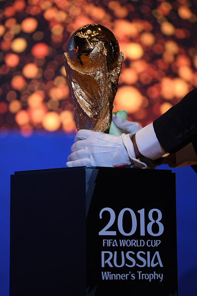 The FIFA World Cup trophy arrived in Moscow on Sunday carried by Germany's Lothar Mathaus, following its biggest global tour in the tournament's history, with less than two weeks to go before the 2018 edition kicks off. Mathaus, who helped West Germany win the tournament in 1990, unveiled the 6.1 kilogram, 18 carat solid gold trophy - which has been handed to the winner of the competition since the 1974 edition - in an event held near the Kremlin, reports Efe. The trophy will be exhibited at Gorky Park and Pushkinskaya Square, where fans can take photos under tight security measures. Nine months ago, the trophy started its world tour at Luzhniki in an event attended by FIFA President Gianni Infantino. FIFA World Cup,FIFA World Cup 2018,FIFA Legends Fan,FIFA Fans,Fans take selfies,Fans take selfies with FIFA World Cup,FIFA World Cup pics,FIFA World Cup images,FIFA World Cup stills,FIFA World Cup pictures