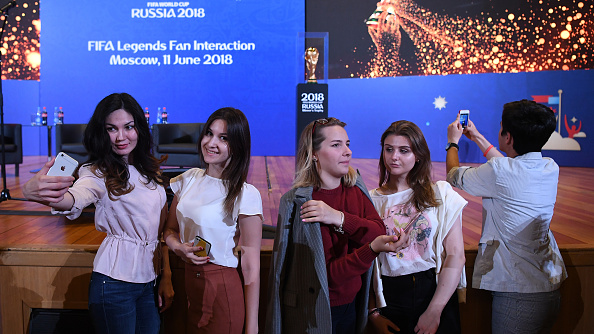 Hundreds of people, including dozens of young soccer players, gathered in the centre of Moscow to see the trophy as it arrived in the Russian capital, 11 days ahead of the opening match pitting the hosts against Saudi Arabia. FIFA World Cup,FIFA World Cup 2018,FIFA Legends Fan,FIFA Fans,Fans take selfies,Fans take selfies with FIFA World Cup,FIFA World Cup pics,FIFA World Cup images,FIFA World Cup stills,FIFA World Cup pictures