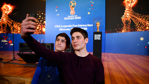 Fans take selfies with the FIFA World Cup trophy ahead of a FIFA Legends Fan Interaction Event at the Moscow University Lbrary on June 11, 2018 in Moscow, Russia. FIFA World Cup,FIFA World Cup 2018,FIFA Legends Fan,FIFA Fans,Fans take selfies,Fans take selfies with FIFA World Cup,FIFA World Cup pics,FIFA World Cup images,FIFA World Cup stills,FIFA World Cup pictures