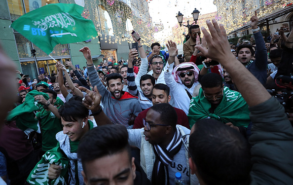 Football fans from Saudi Arabia celebrate near Red Square ahead of the World Cup on June 13, 2018 on June 13, 2018 in Moscow, Russia. Football fans,Football fans in Russia,Russia,World Cup kick-off,FIFA World Cup 2018,World Cup,FIFA World Cup opening,Ronaldo Fifa World Cup opening ceremony