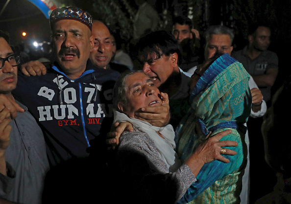 Relatives mourn the death of senior journalist Shujaat Bukhari outside Police Control Room on June 14, 2018 in Srinagar, India. Bukhari was in his vehicle outside his office at Press Enclave when he came under fire. Two of his personal security officers were also injured in the attack. Rising Kashmir,rising kashmir shujat bhukari,Rising Kashmir editor killed,Shujaat Bhukhari,Shujaat Bhukhari funeral,Shujaat Bhukhari funeral pics,Shujaat Bhukhari funeral images,Shujaat Bhukhari dead,Shujaat Bhukhari killed