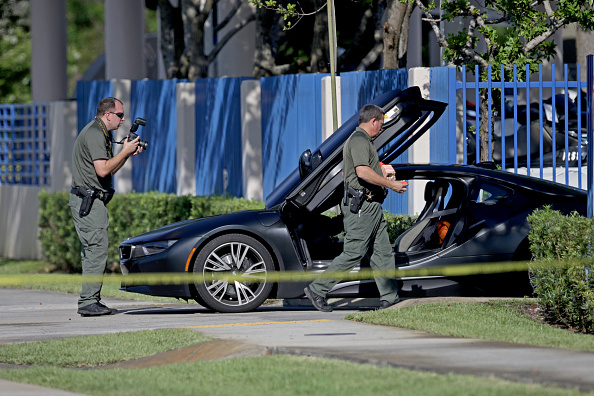 A BMW sits idle after reports of a shooting in Deerfield Beach involving Broward rapper XXXTentacion on Monday, June 18, 2018. The celebrity news site TMZ reports that the 20-year-old XXXTentacion, given name Jahseh Onfroy, was shopping for a motorcycle when a gunman ran up to his vehicle and shot him. Chart-topping rapper XXXTentacion,rapper XXXTentacion,XXXTentacion,Rapper XXXTentacion death,XXXTentacion killed,XXXTentacion shot dead