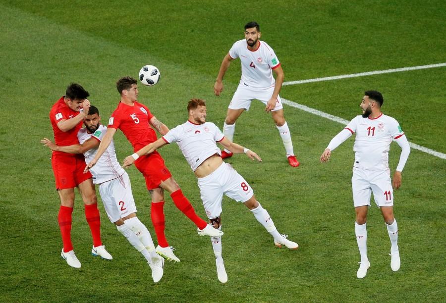 Barely three minutes into the game, Jordan Hernderson sent a cross-field ball towards the right side of the Tunisian box for Dele Alli to bring it down before. But his square pass across the goal to Raheem Sterling was half cleared. The rebound fell to Jesse Lingard, whose drive from the 12 yards out was blocked by a outstretched left leg of keeper Mouez Hassen. Four minutes later, Sterling overcame three defenders from the left byline before rolling the ball across the face of the goal to the right post where Lingard was waiting. But when the pass arrived, it somehow wrong-footed the teenager and bounced off his shins for a goal kick. However, the energetic English team was not to be denied the lead for very long as a diving Hassen's block off a header from John Stones following a corner fell at the feet of Kane, who easily tapped it home in the 11th minute. 2018 FIFA World Cup,FIFA World Cup,FIFA World Cup 2018,England 2 - Tunisia 1,England beats Tunisia,FIFA World Cup pics,FIFA World Cup images,FIFA World Cup stills,FIFA World Cup pictures,FIFA World Cup photos