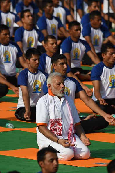 On the fourth edition of International Yoga Day, Prime Minister Narendra Modi asserted that Yoga has become one of the unifying forces of the world. Addressing the gathering on the occasion here, Prime Minister Modi said, "In today's fast changing time, Yoga binds together a person's body, brain and soul, hence making one experience a feeling of peace. Dehradun se Dublin tak, Shanghai se Chicago tak, Jakarta se Johannesburg tak, Yoga hi Yoga hai (From Dehradun to Dublin, Sanghai to Chicago, Jakarta to Johannesburg, there is Yoga all around). Yoga has become one of the unifying forces of the world." Emphasising on the power of yoga and its global reach, Prime Minister Modi said, "Yoga is India's gift to the world. It is a passport for wellness. The world has embraced Yoga and glimpses of this can be seen in the manner in which International Day of Yoga has been marked every year. In fact, Yoga Day has become one of the biggest mass movements in the quest for good health and well-being." The Prime Minister added that India is Yoga's top ambassador. International Yoga Day 2018,International Yoga Day,Yoga Day 2018,Narendra Modi,Modi performs Asanas,Modi performs yoga,Modi doing yoga