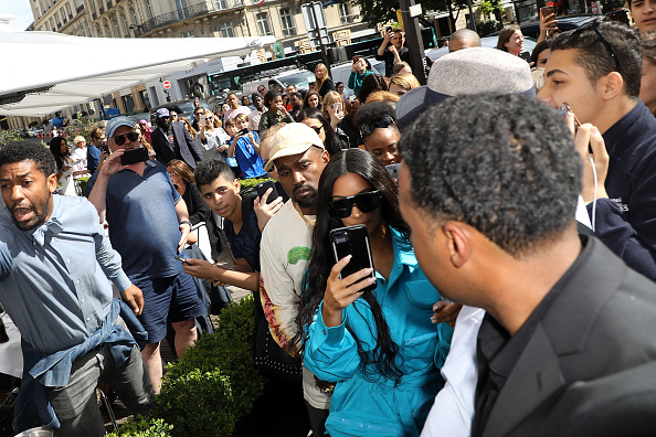 After being robbed at gunpoint in a city hotel year-and-a-half ago, American reality television personality Kim Kardashian was back in Paris, along with rapper husband Kanye West on Thursday. According to E! Online, the 'Keeping Up With the Kardashians' star attended the Louis Vuitton Menswear spring/summer 2019 Paris Fashion Week show. She was spotted with sister Kylie Jenner and her boyfriend Travis Scotton, other than her husband. Earlier in 2017, Kim in her reality show had said that she might return to Paris "maybe in like, five, six, seven, ten years" according to E! Online. Kim Kardashian returns to Paris,Kim Kardashian,kim kardashian in paris,Kanye West,Kim Kardashian Kanye West