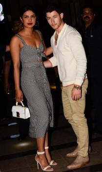 Actress Priyanka Chopra, who has brought her rumoured boyfriend Nick Jonas to India, stepped out for a dinner date with the US-based singer here on Friday. In some photographs surfaced online, the duo can be seen walking hand-in-hand during their low-key outing. While Priyanka opted for a black-and-white checkered dress for the outing, Nick, on the other hand, looked pretty relaxed as he walked next to Priyanka donning a white shirt and khakhee pants. Priyanka and Nick, who have been romantically linked to each other ever since 2017 MET Gala, where they walked the red carpet together in Ralph Lauren designs, landed in India on Thursday night.