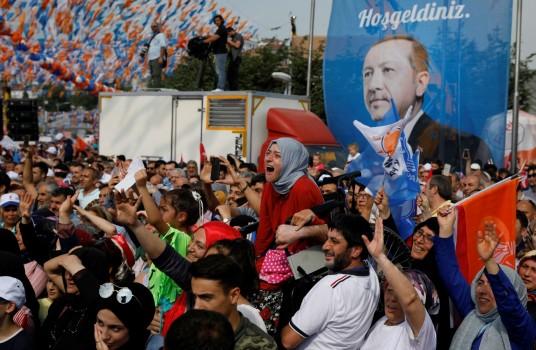 Polls suggest Sunday’s vote may be close, with the AK Party possibly losing its parliamentary majority and the presidential vote potentially going to a second round. A girl in a wheelchair is raised in the air to watch Turkish President Tayyip Erdogan during an election rally in Istanbul, Turkey June 22, 2018.