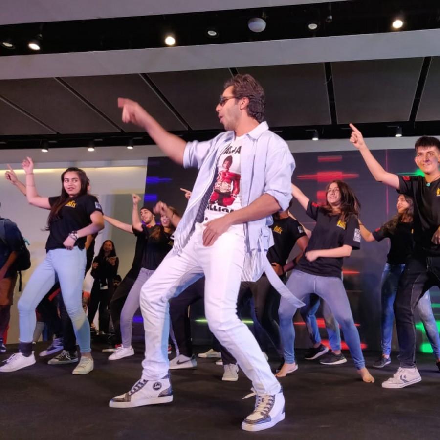 From "Tan tana tan" to "Badrinath ki dulhania" and "Palat", actor Varun Dhawan danced to his popular tracks at a mall here on Saturday. Fans flocked in huge numbers at the luxurious Emquartier mall here, just to get a glimpse of their favourite star Varun, who looked dapper in a casual dress. As Varun entered, the crowd welcomed him with loud cheers and whistles. He even shook a leg with two children and was heard speaking in Thai. The actor also reminisced about shooting in Bangkok for his film "Main Tera Hero" in 2014. The film also starred Ileana D'Cruz and Nargis Fakhri. Varun Dhawan,actor Varun Dhawan,Varun Dhawan at IIFA Rocks 2018,Varun Dhawan at IIFA Rocks,IIFA Rocks 2018,IIFA Rocks red carpet,IIFA Rocks 2018 pics,IIFA Rocks 2018 images,IIFA Rocks 2018 stills,IIFA Rocks 2018 pictures,IIFA Rocks 2018 photos