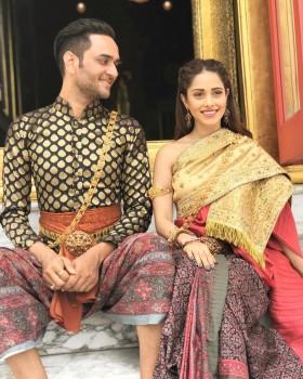Actress Nushrat Bharucha was recently seen at Bangkok Bundit Patanasilpa Institute in Thailand, in a new avatar. The 'Pyar Ka Punchnama' actress was wearing the traditional attire 'Chut Thai.' Chut Thai for women usually consists of a pha nung or a chong kraben, a blouse, and a sabai and for men, it includes a chong kraben or pants, a Raj pattern shirt, with optional knee-length white socks and a sabai. The actress posed with Vikas Gupta of 'Big Boss 11' fame for Thailand tourism. It is notable that the 'Akash Vaani' actress is in Bangkok to attend the 19th edition of International Indian Academy Awards (IIFA).