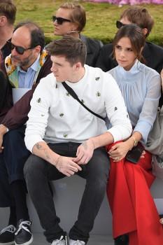 Fashion designer Victoria Beckham attended the Paris Fashion Week with eldest son Brooklyn Beckham on Saturday, days after she squashed speculation about a divorce from husband David Beckham. 