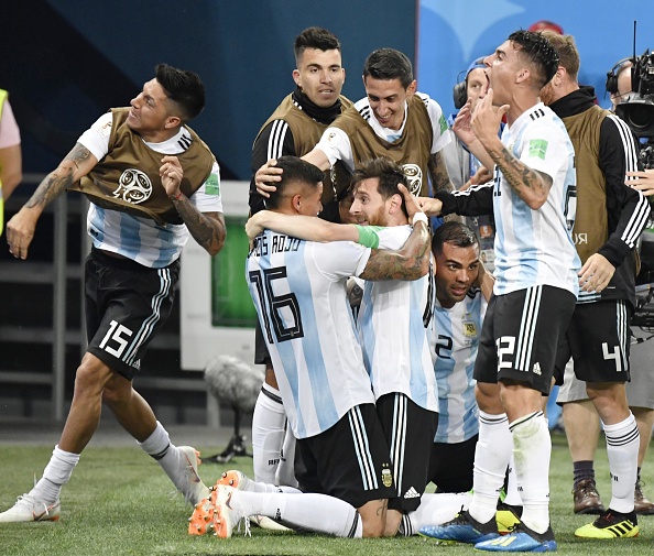 A late goal from Marcos Rojo gave Argentina a 2-1 triumph over Nigeria in their final Group D match here on Tuesday as the two-time champions entered the FIFA World Cup pre-quarterfinals. Rojo scored the winner for Argentina in the 86th minute after Victor Moses' penalty conversion in the 51st minute had cancelled out Lionel Messi's strike in the 14th minute. Following the win, Argentina have four points in total and they are second in the table, behind Croatia, who have nine points. The other two teams in the group, Nigeria (three points) and Iceland (one point) have crashed out of the tournament. Argentina, who were on the brink of elimination after playing a draw against Iceland before a disastrous 0-3 defeat to Croatia in their first two matches, started the match against Nigeria with one point in their bag. They knew that despite a win against Nigeria, who were also in contention, their spot in the Round-of-16 is not guaranteed as Croatia, who had already qualified, played Iceland. Marcos Rojo,lionel messi,Argentin,FIFA World Cup,FIFA World Cup 2018,argentina beats nigeria,argentina beats nigeria by 2-1