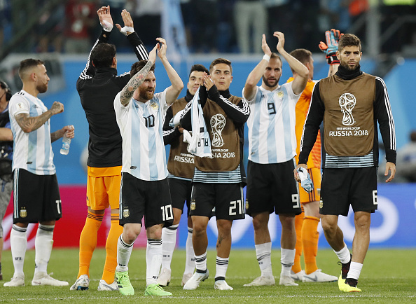 Argentina head coach Jorge Sampaoli, who had got a lot of stick for his formation of the team in the first two matches, fielded a classic 4-4-2 formation, featuring wholesale changes to their starting 11 comparing with the game against Croatia when they lost 0-3. Argentina showed a lot of urgency, both up front and at the back as they began to prowl inside the Nigerian box from the start. Gonzalo Higuain and Angel Di Maria pressed high on Nigeria's box as they looked to make the best of their first appearances in the starting XI. It took only 14 minutes for the Argentines to break the deadlock. Messi controlled with his thigh a long-range aerial ball from the centre of the pitch from Ever Banega before barging into the box and firing to the left corner of the net despite being pushed towards the right side by Kenneth Omeruo. Banega, who was not there in the starting XIs so far, had already repaid Sampaoli's faith. Marcos Rojo,lionel messi,Argentin,FIFA World Cup,FIFA World Cup 2018,argentina beats nigeria,argentina beats nigeria by 2-1