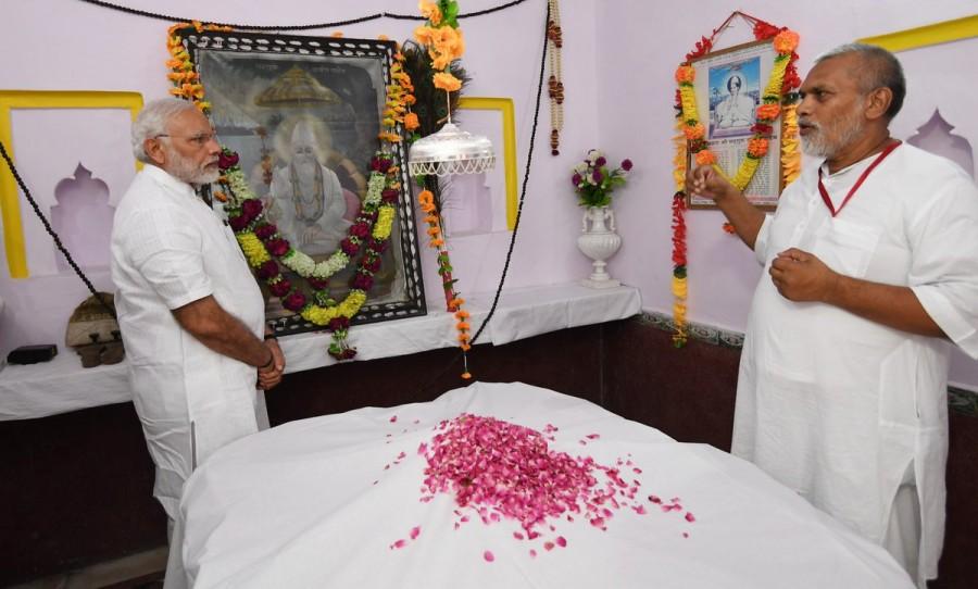 His own government was driven by the basic tenets of equality and uplifting the poor, all of which were dear to Kabir. Earlier, due to the flooding of the Gorakhpur airport runway, the Prime Minister's aircraft landed in Lucknow where he was welcomed by Uttar Pradesh Governor Ram Naik, Adityanath and others. Modi pays tributes to Kabir Das,Kabir Das,Modi in Maghar,Narendra in Maghar,saint Kabir Das,Sant Kabir Nagar