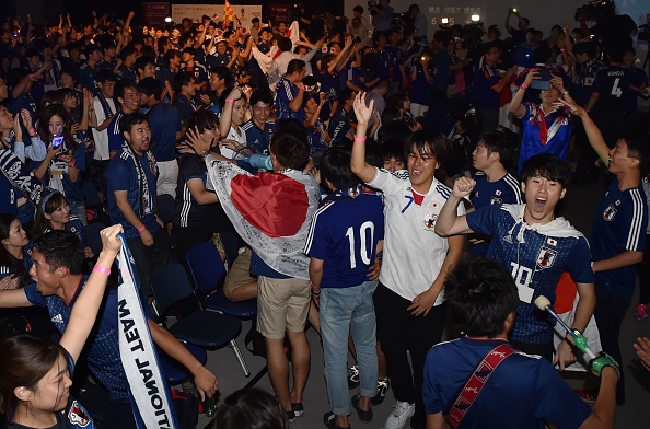 Supporters celebrate Japan's qualifying while watching Japan's third World Cup football match in Group H against Poland at a public viewing in Tokyo on June 29, 2018. FIFA World Cup,Japan enter pre-quarters,Japan beats Poland,FIFA World Cup pre-quarterfinals,Group H,2018 FIFA World Cup,FIFA World Cup 2018